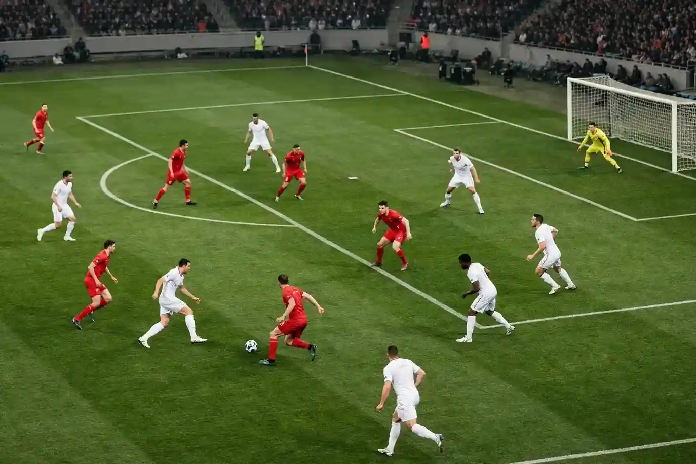 Komplexe Spielsituation auf dem Fußballfeld mit mehreren Spielern